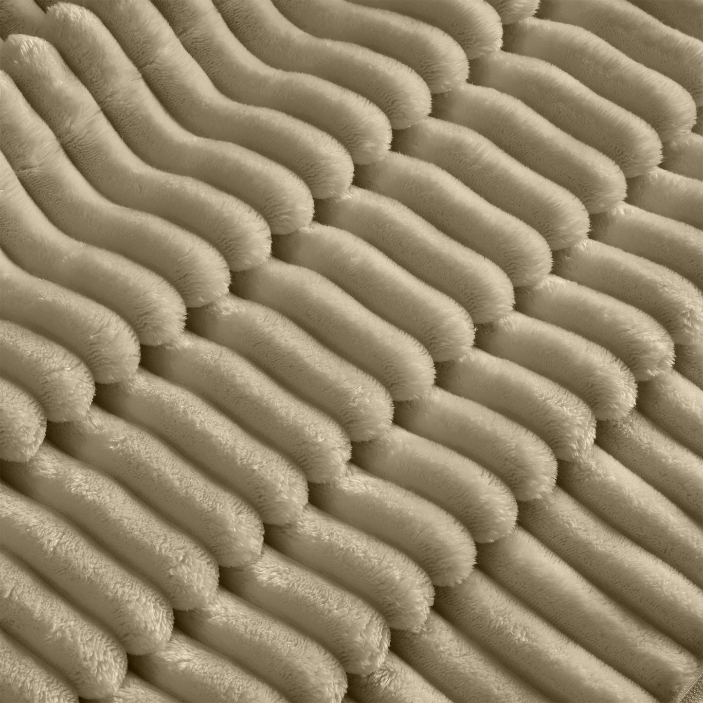Close-up detail of the fluffy camel corduroy sectional’s wide-wale fabric, highlighting the soft, textured surface and rich, cozy appearance.