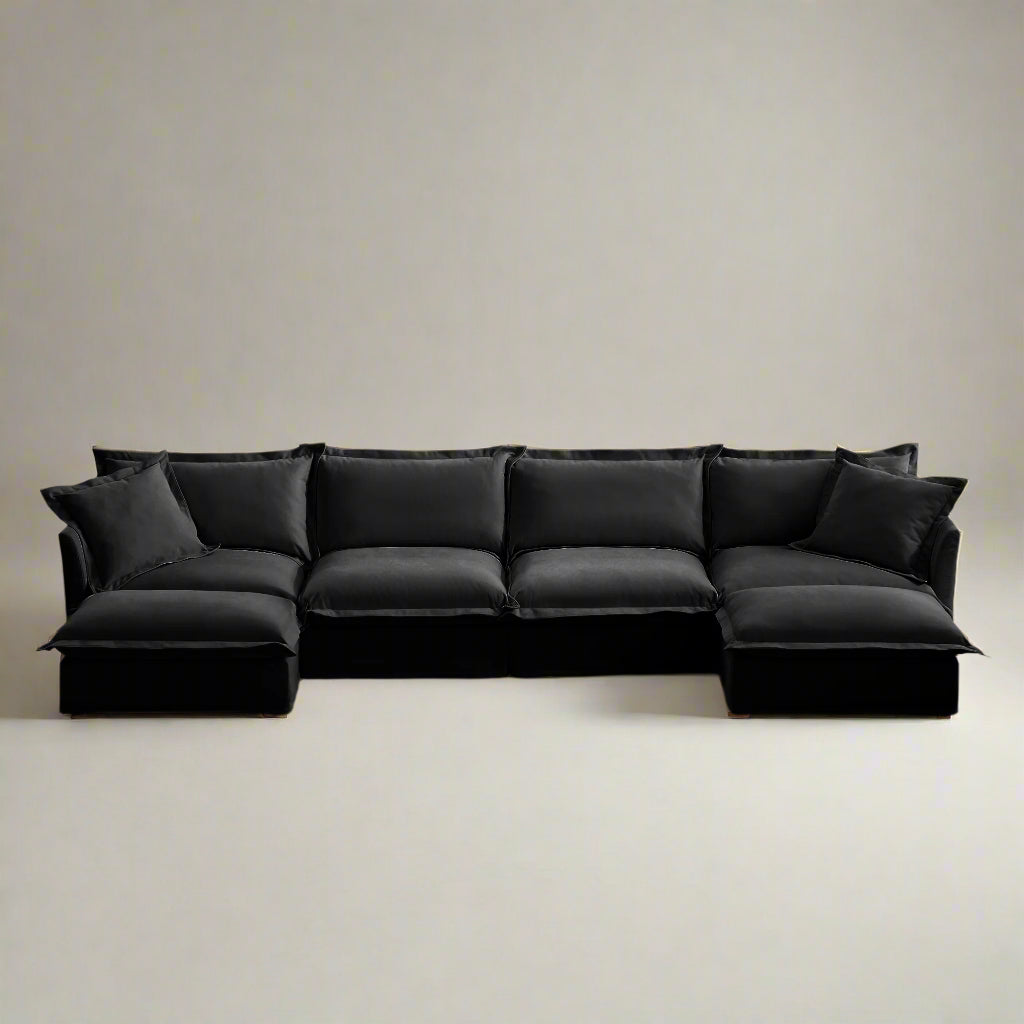 Fluffy black chenille sectional sofa with two ottomans, featuring deep seats, sculpted lines, and machine washable slipcovers — modular design ideal for L or U shaped couch setups.