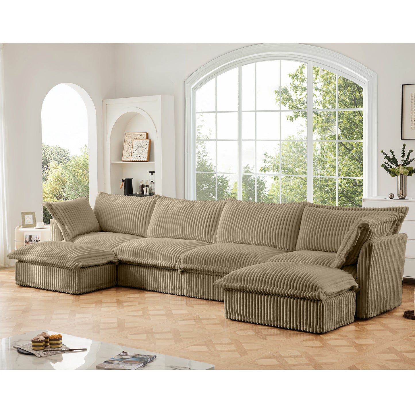 Lifestyle shot of a fluffy camel corduroy sectional with two ottomans, highlighting its soft wide-wale texture, deep seating, and modular design with machine washable covers.