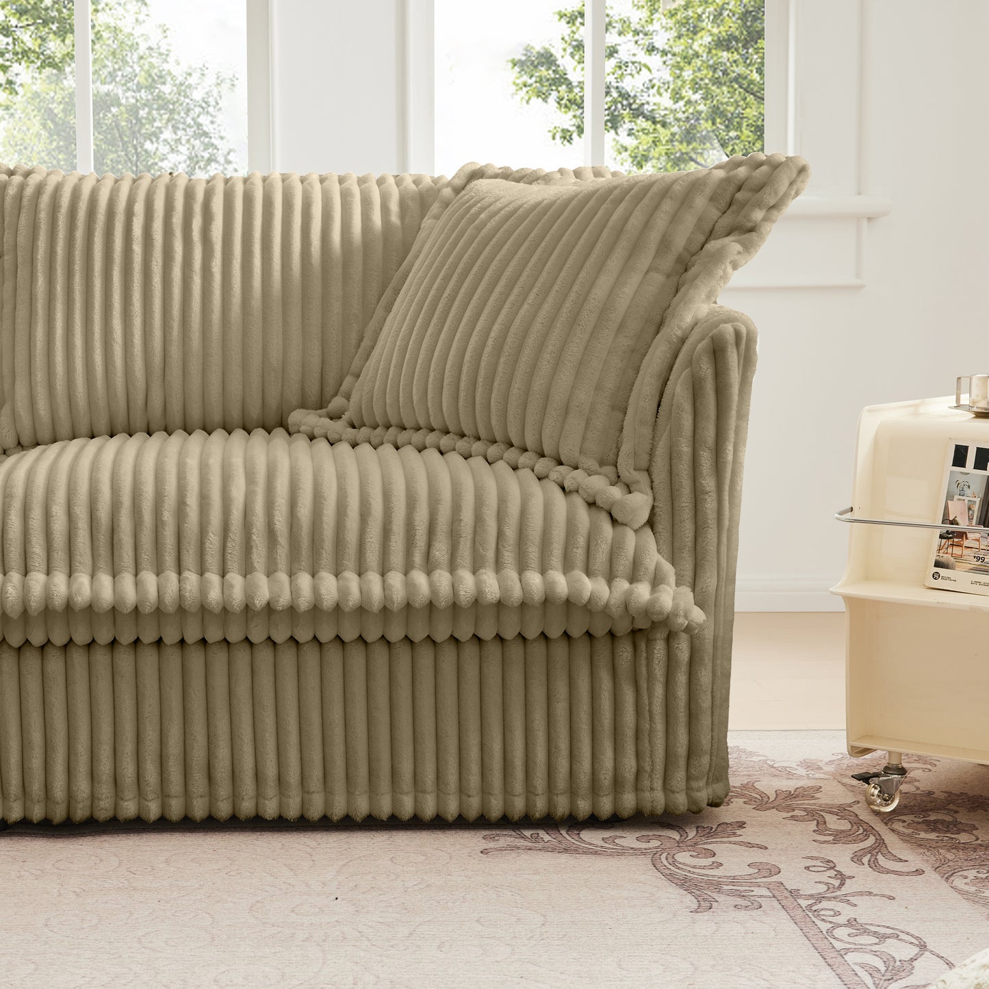 Front-side view of a fluffy camel corduroy sectional highlighting the armrest, seat cushion, and soft wide-wale fabric for a cozy, inviting look.
