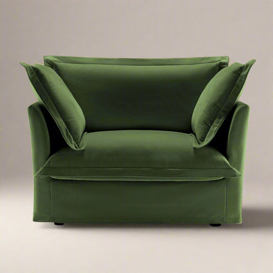 Fluffy Chair in Olive with a wide deep seat comfortable cushions and pillows showing a rich green color