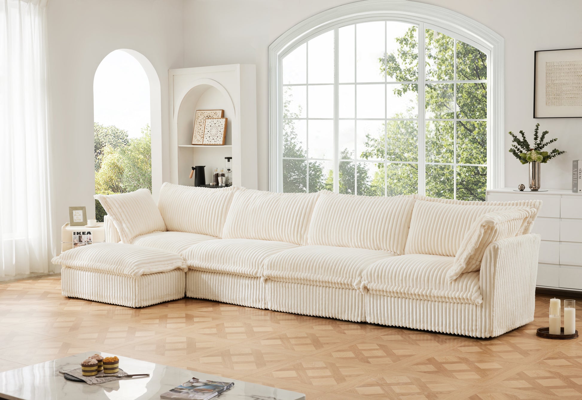 Fluffy cream corduroy 4-seat couch with a matching ottoman, styled in a modern home setting. Showcases ultra-soft, textured fabric and removable, washable covers for everyday comfort and easy maintenance.