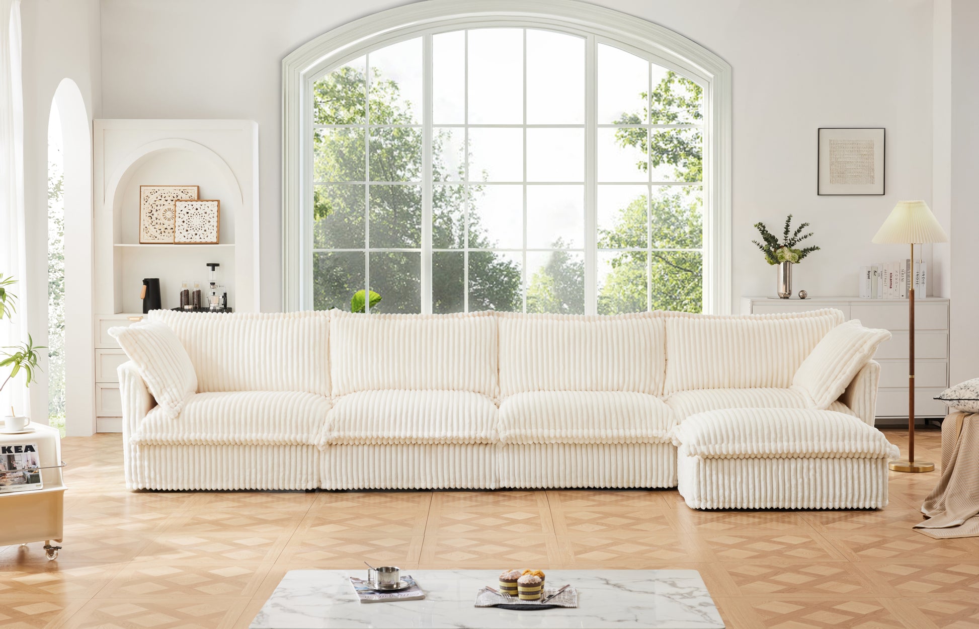 Fluffy cream corduroy couch with four seats and a matching ottoman, featuring soft, textured fabric and removable, washable covers for easy cleaning.