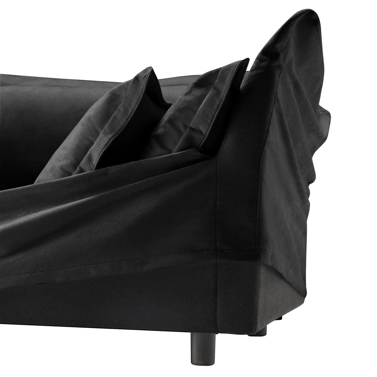 Frontal close-up of the end of a fluffy black chenille sectional — highlighting the removable, machine washable slipcover on the armrest and cushion for easy, pet-friendly maintenance and everyday comfort.