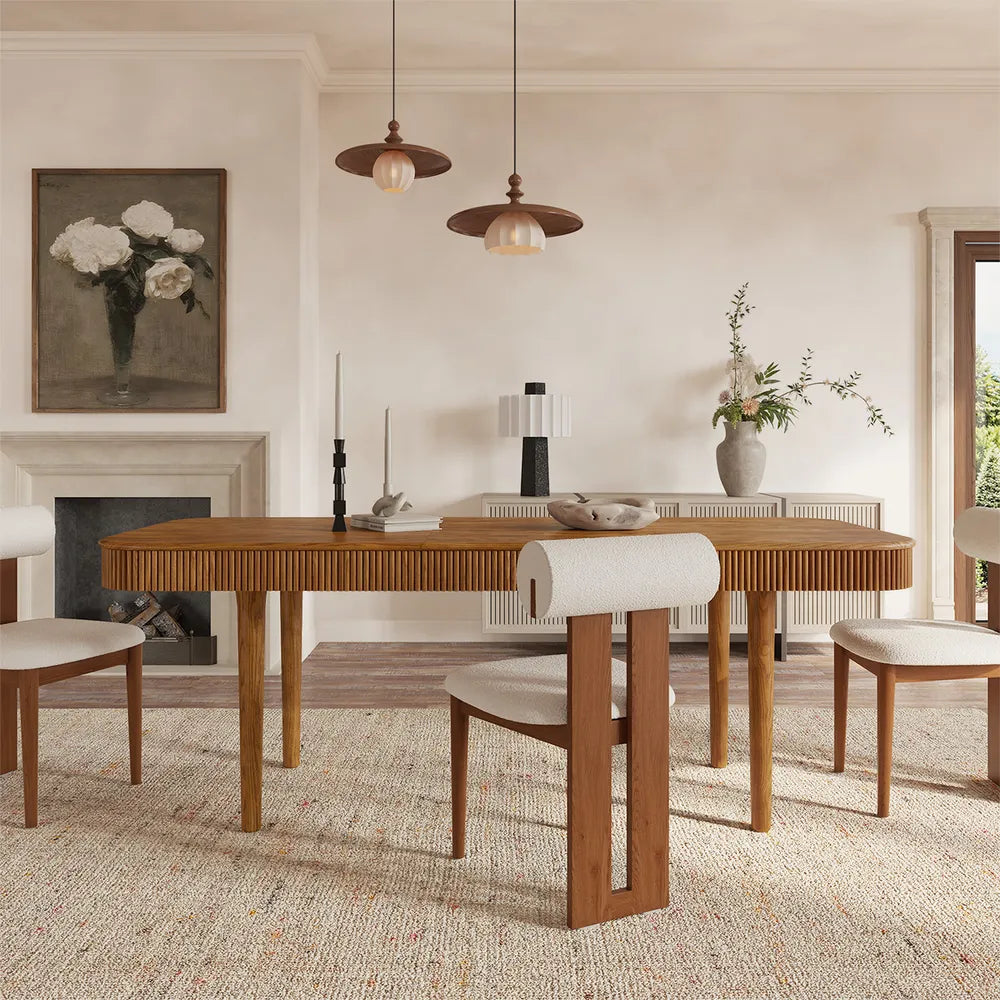 Lifestyle shot of modern extendable ash wood dining table with fluted detailing, styled in a contemporary dining room and extended to seat 6.