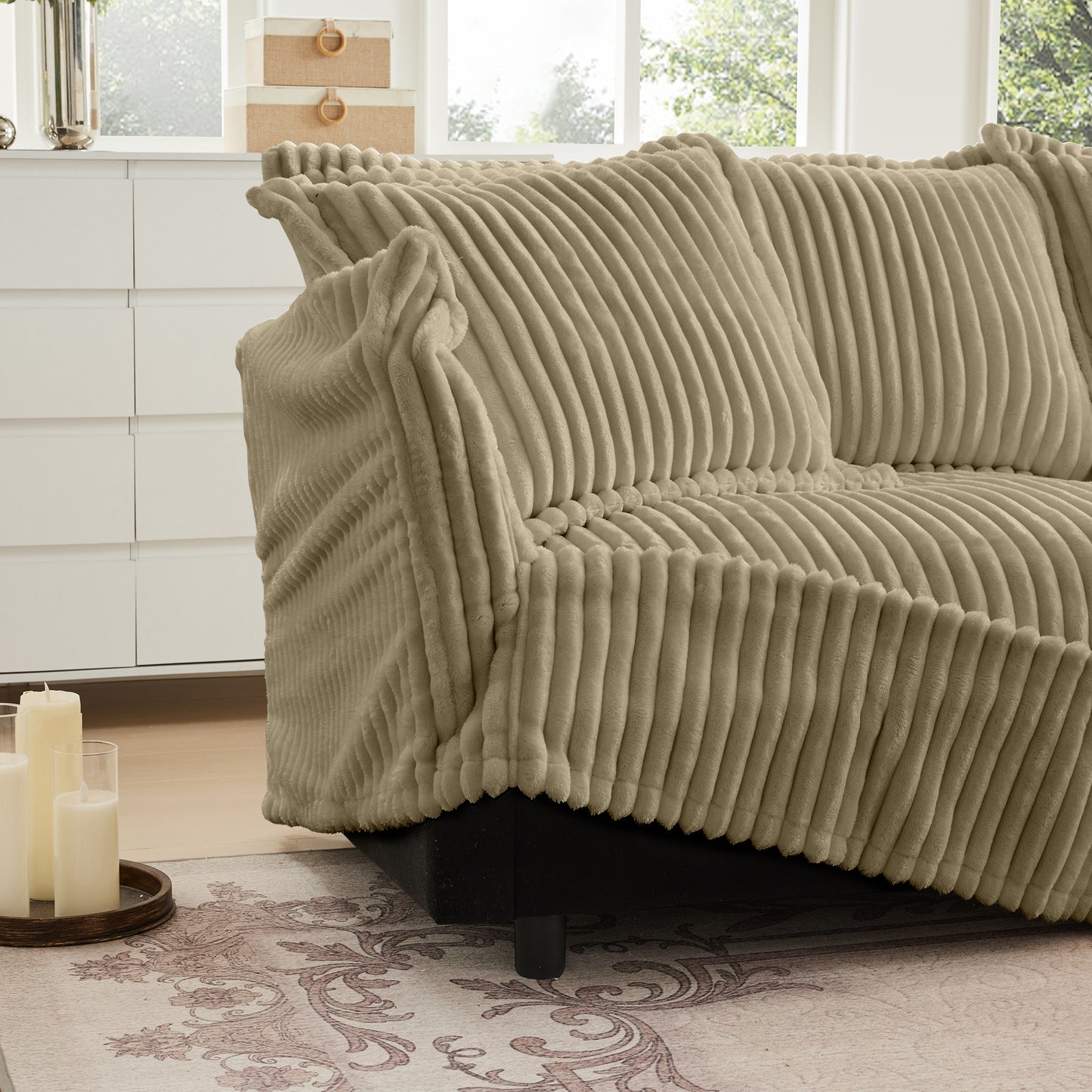 Close-up of the camel corduroy sectional showing an unzipped cushion cover, highlighting the removable, machine washable slipcover and durable wide-wale fabric.
