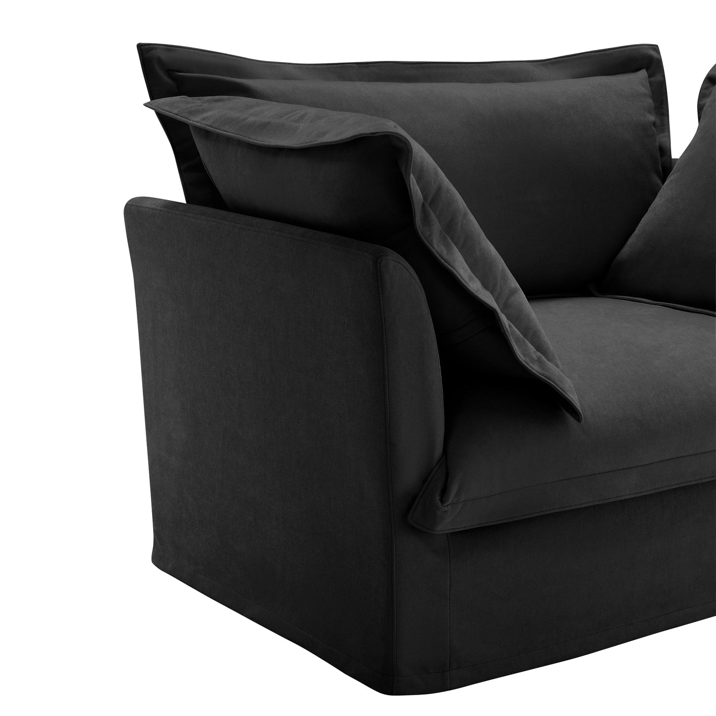 Side view of a fluffy black chenille sectional sofa — showcasing the soft armrest, deep seating, and smooth, machine washable slipcovers designed for cozy lounging and pet-friendly living.