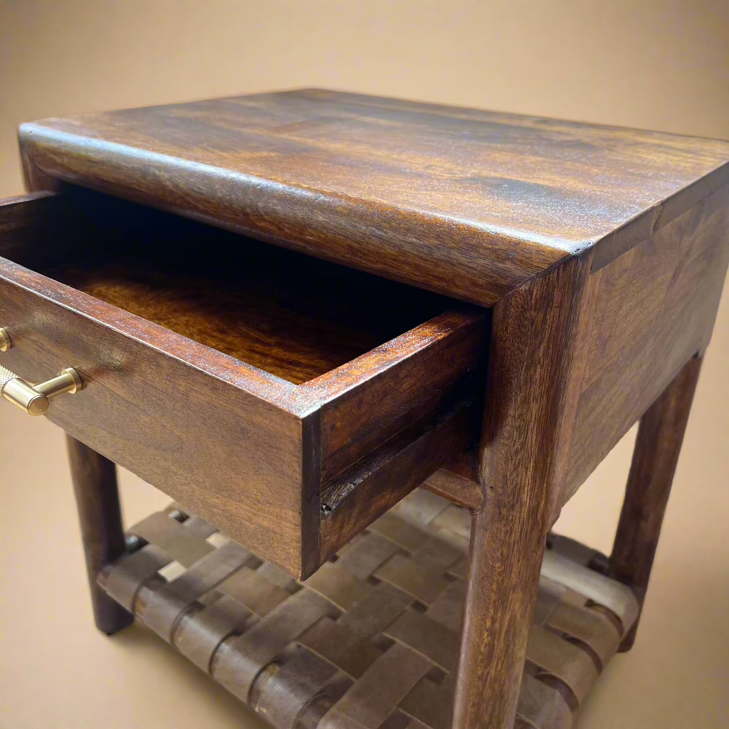 corner view of open drawer on solid wood nightstand made of mango showing woven shelf and wood pattern in chestnut finish
