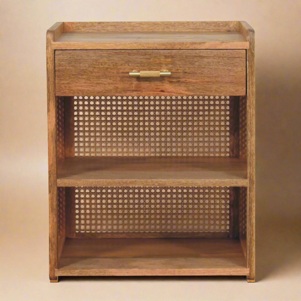 Closeup of solid mango wood nightstand with single drawer and two shelves showing the rattan back feature