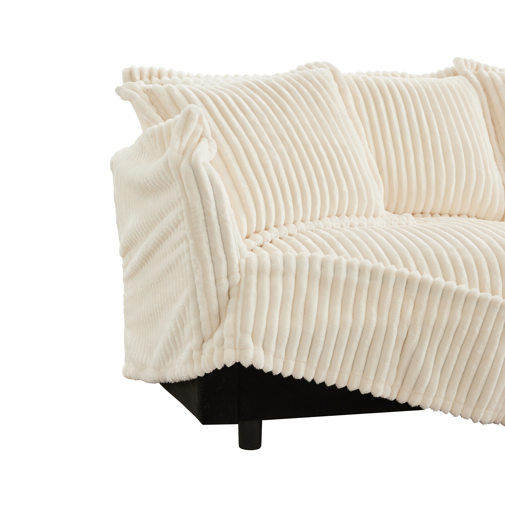 Side view of a cream corduroy couch with a cushion cover being removed, showing the ease of taking off the soft, washable fabric for cleaning.