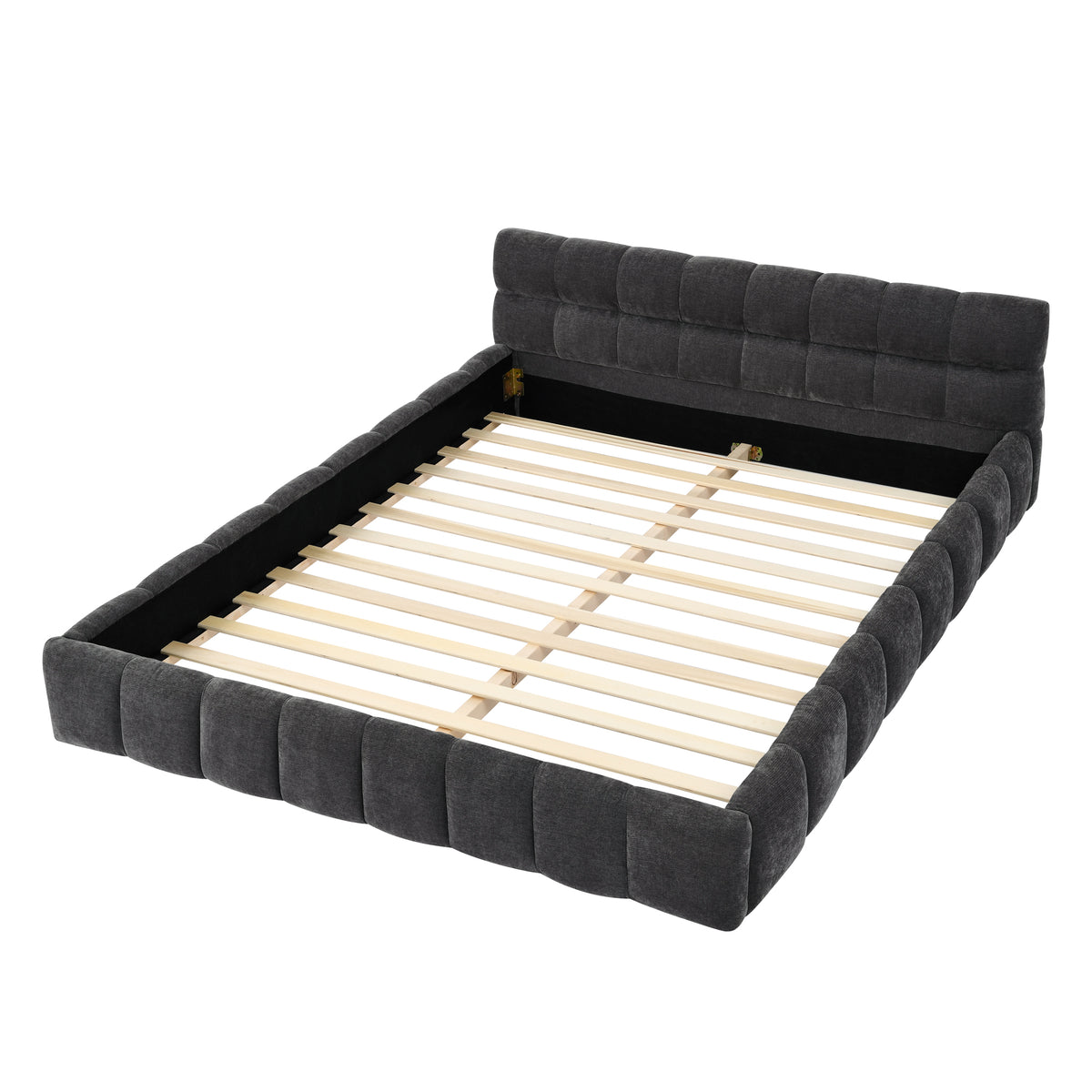 Dark grey chenille channel-tufted platform bed made up in a bedroom, side angle with rug