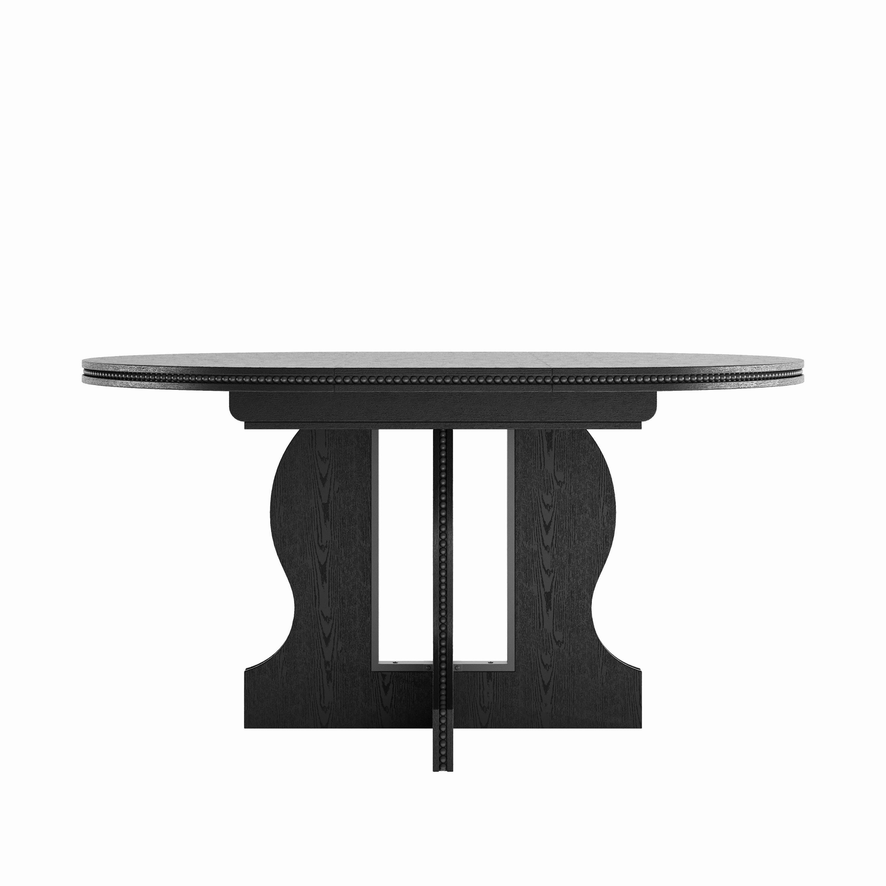 Black oval extendable dining table in round form, front view on a plain white studio background showing the pedestal base