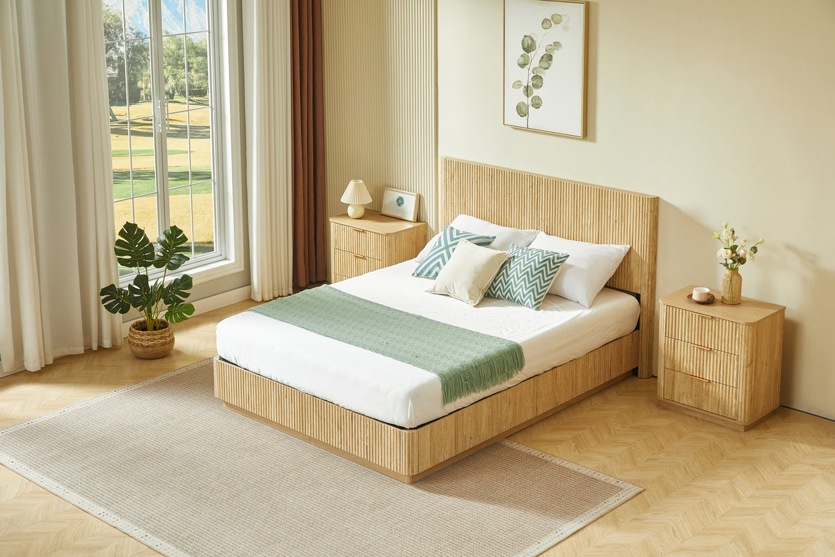 Wide angled light oak fluted queen bed styled in a bright bedroom flanked by two nightstands