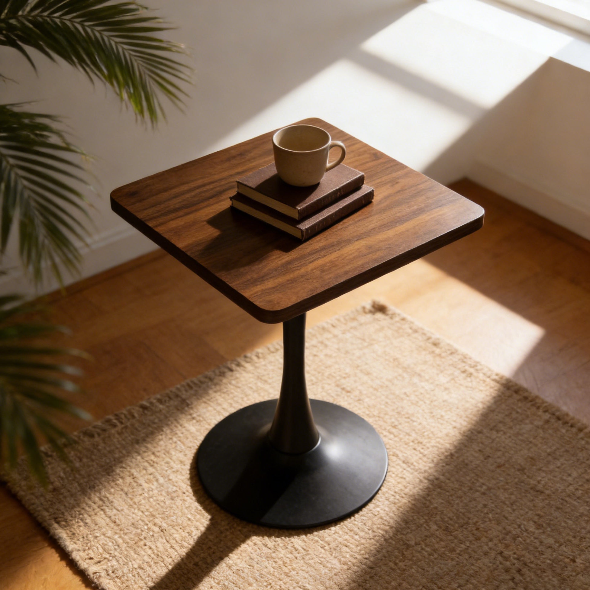 Three-quarter high angle of the walnut square tulip bistro table on a jute rug near a window