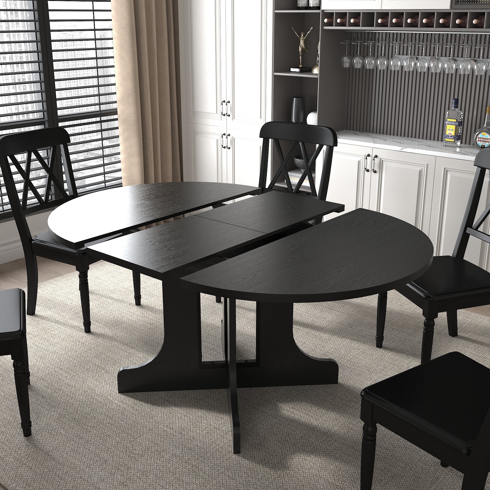 Black table split open with the two rounded halves apart and the folding leaf exposed