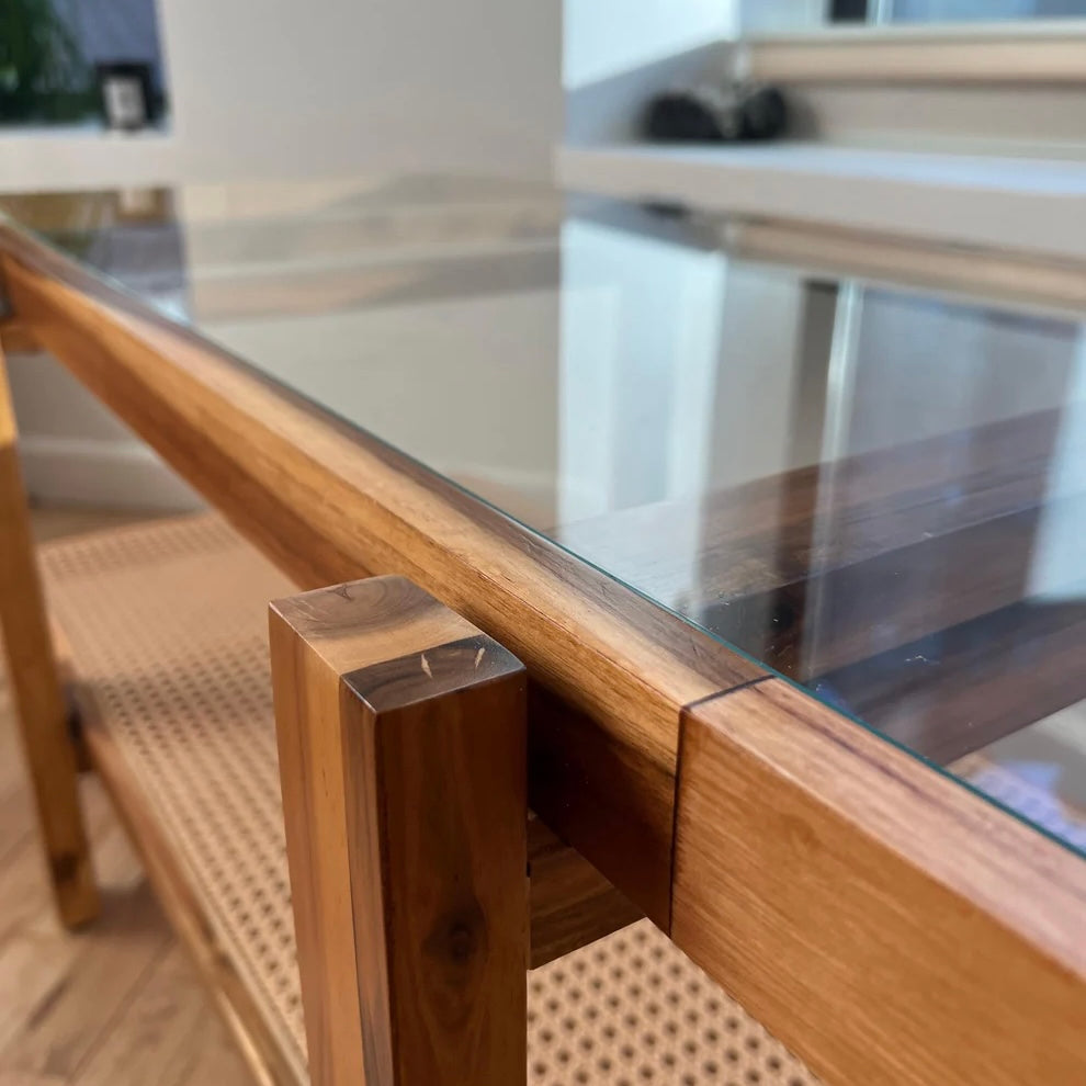 detail shot of the coloration of natural acacia wood on a coffee table with tempered glass