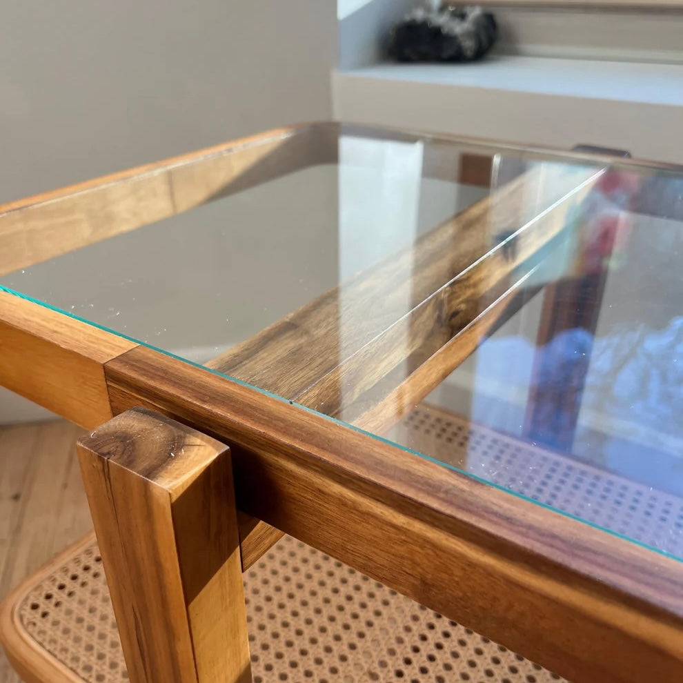 close up of acacia wood and tempered glass on a solid wood coffee table