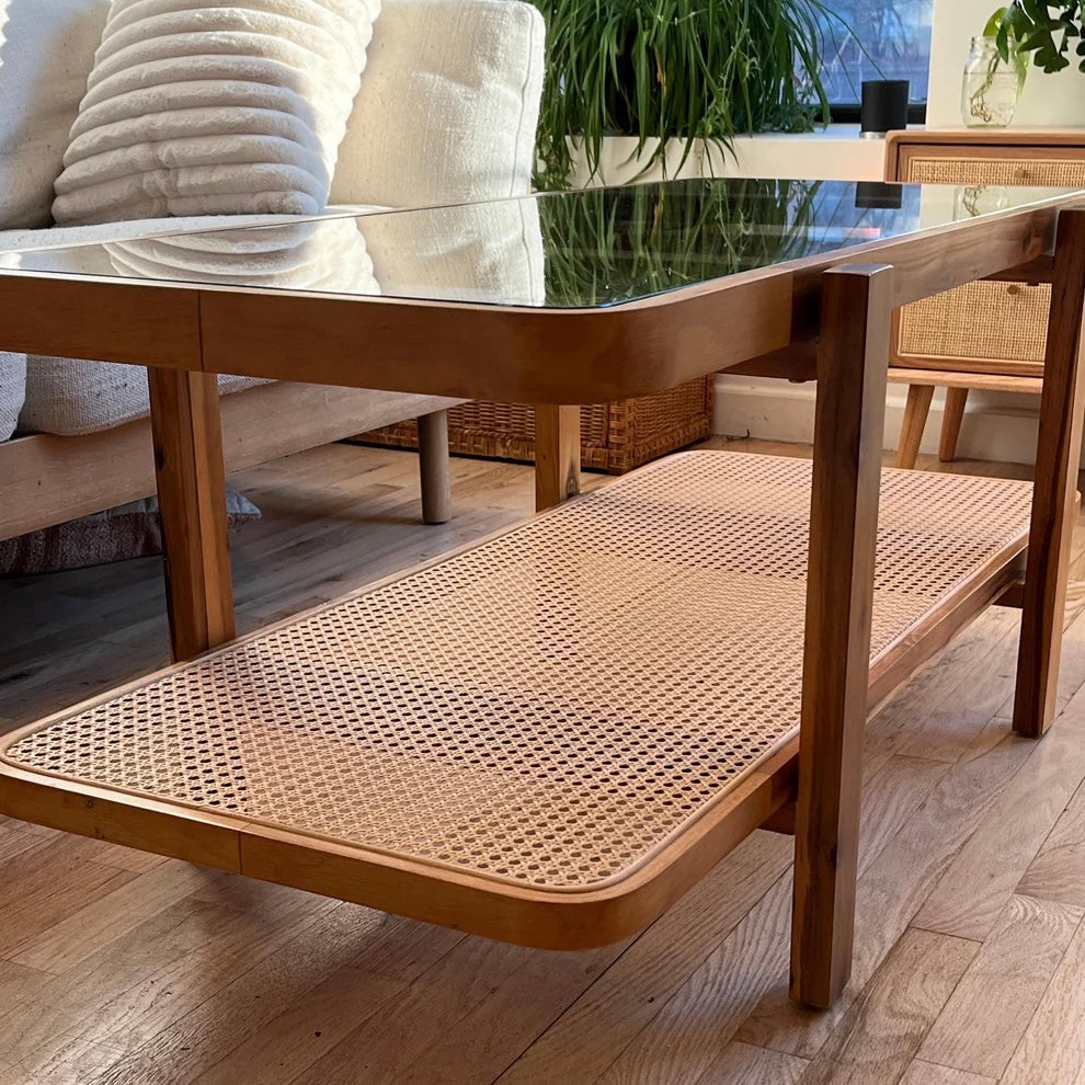 lower shelf of acacia wood coffee table with rattan accent