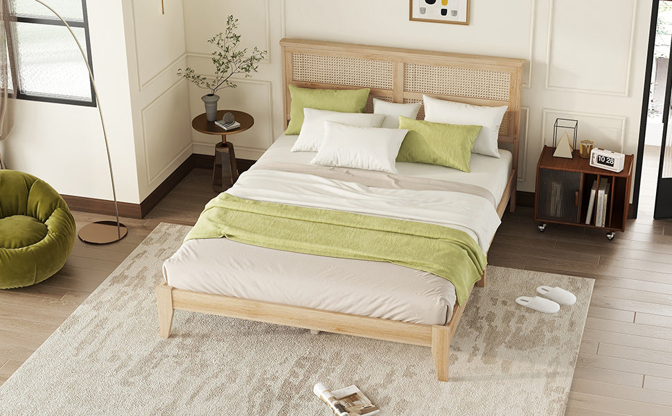 Overhead room shot of the natural queen wood bed frame with rattan headboard and a green accent chair