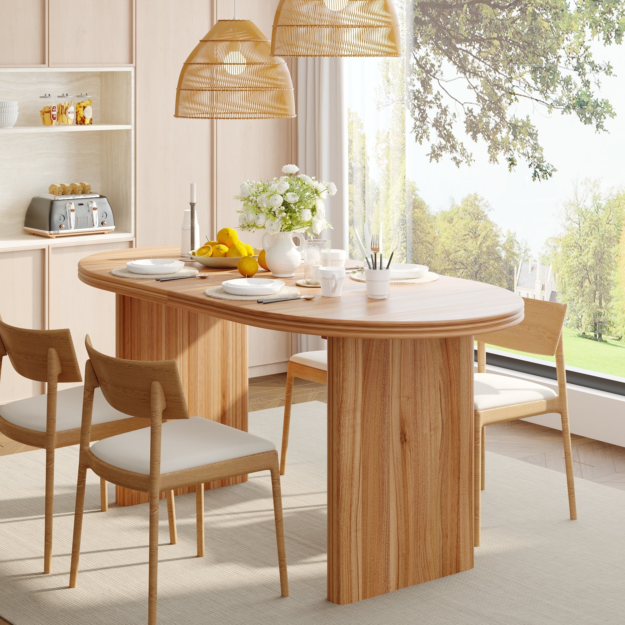 Angled view of the natural wood oval extendable table with wood chairs and a sideboard