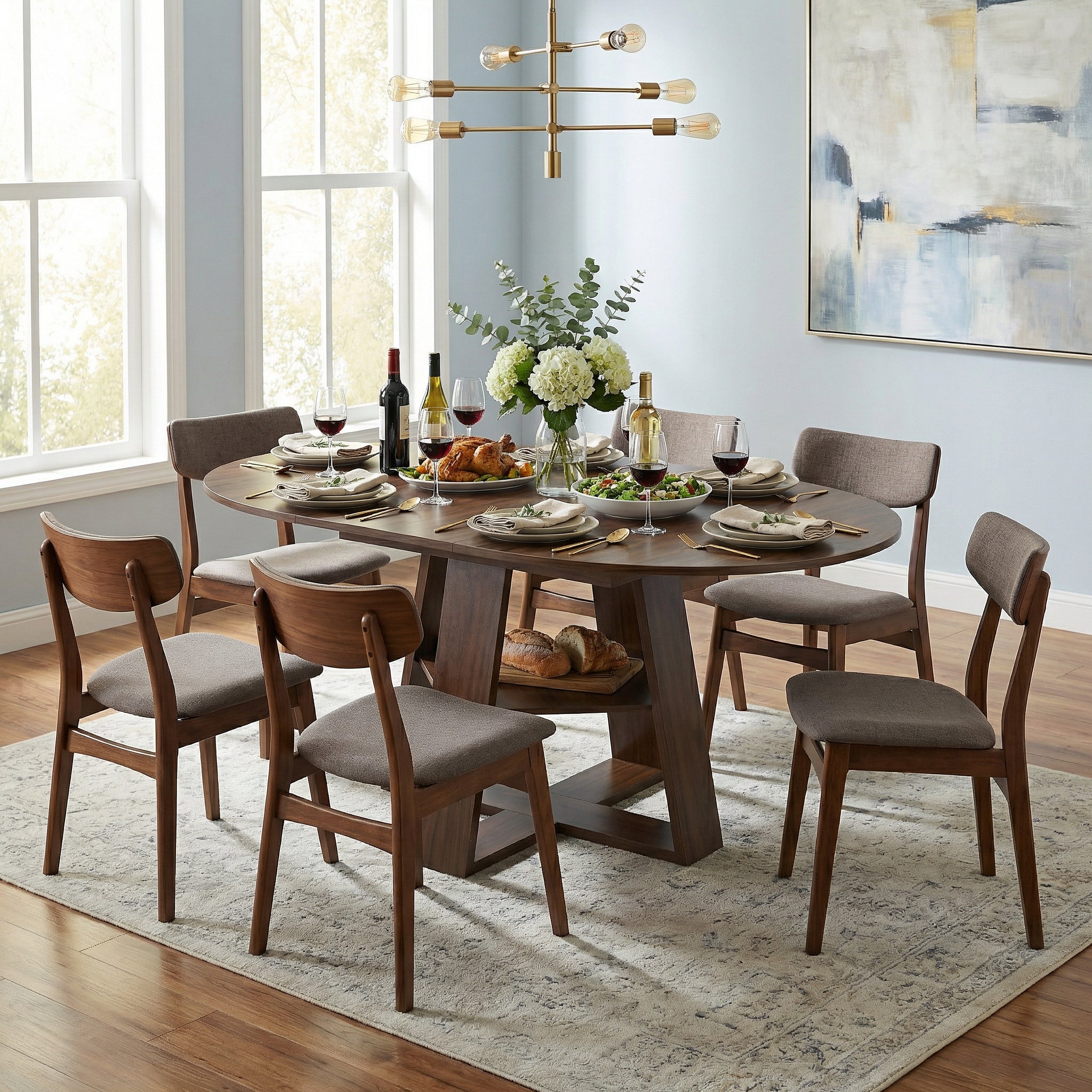 Styled dining room with the walnut table extended to an oval and set for six