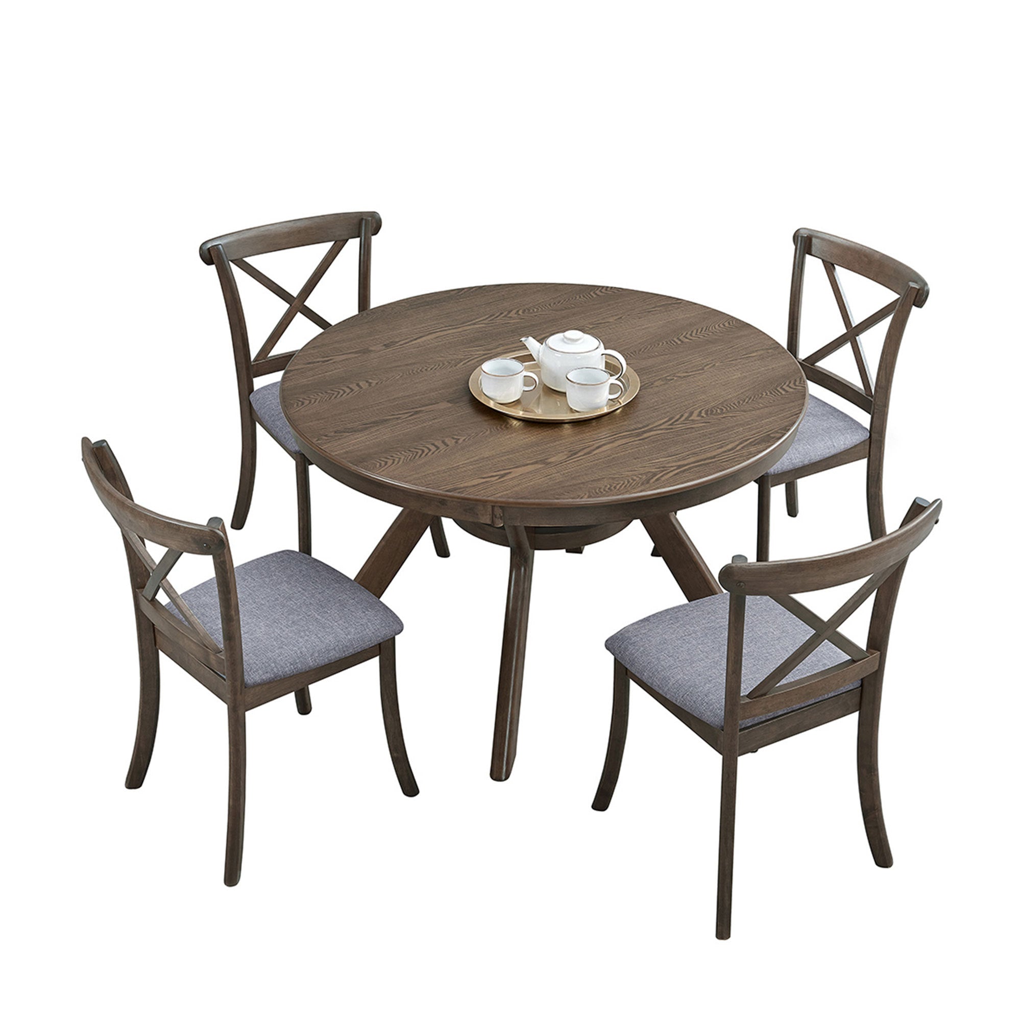 Round oak dining table with four cross-back chairs and a gold tea tray on plain white