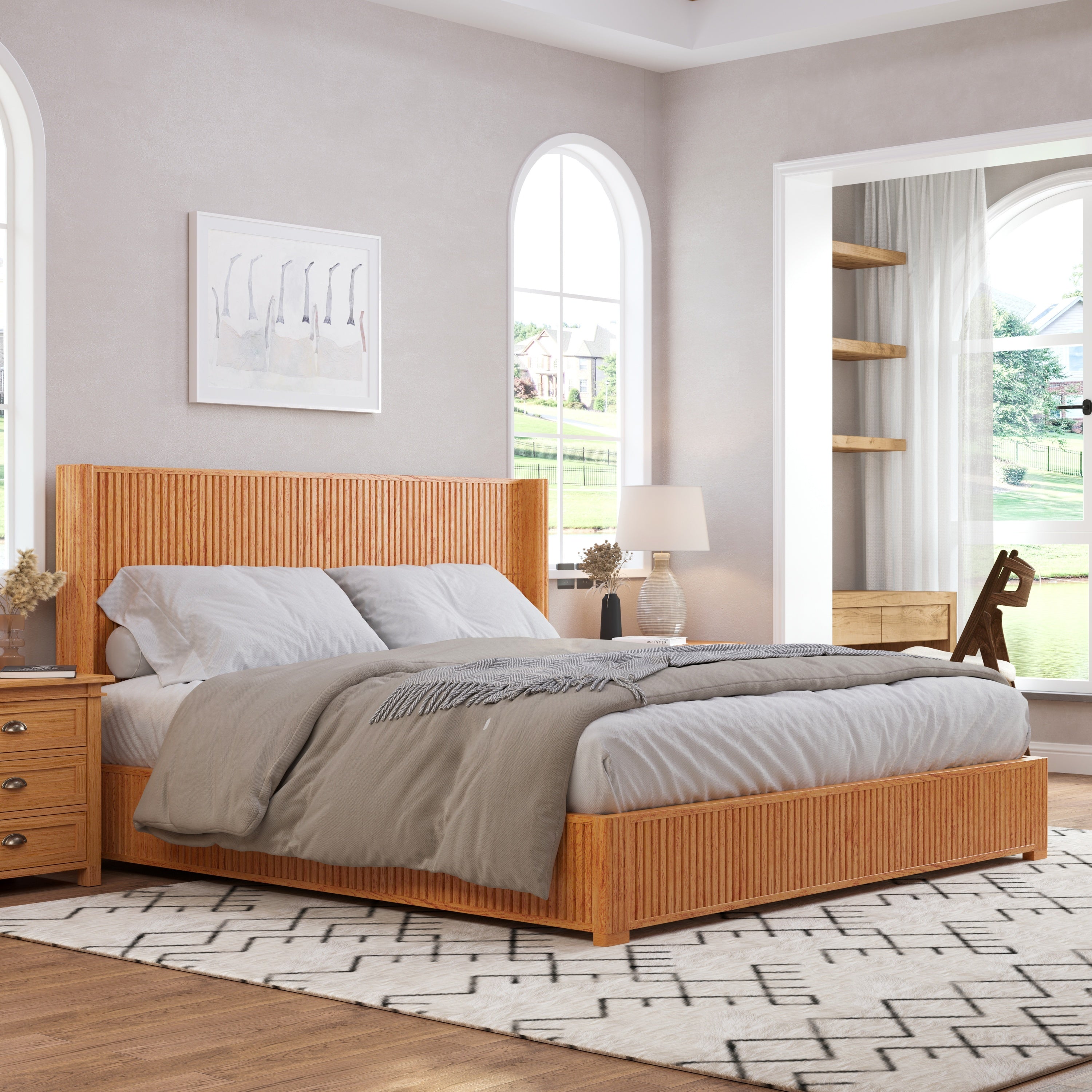 Natural wood king floor bed in airy bedroom with matching nightstands