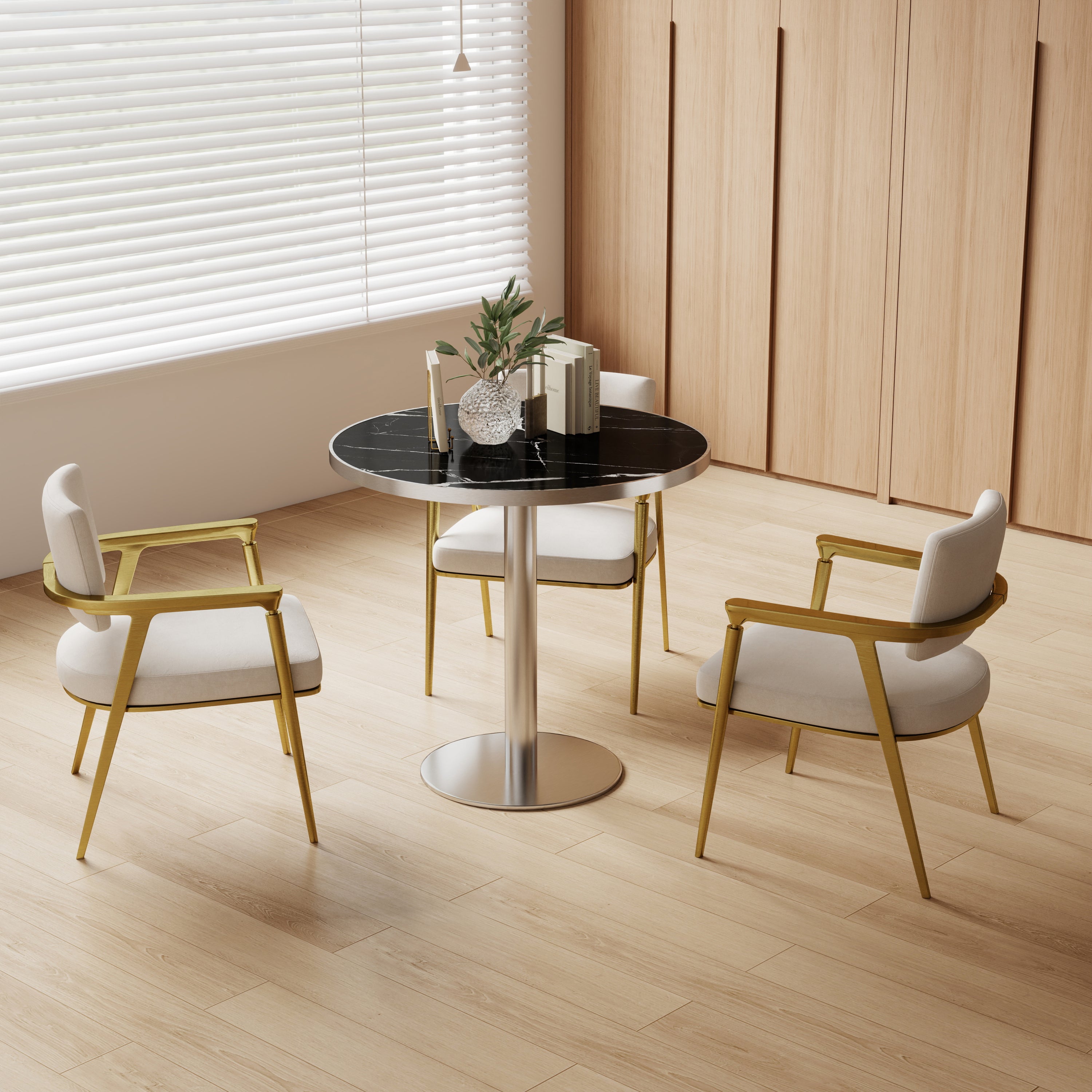 Black sintered stone round table with two cream gold-frame chairs in a wood-paneled room by a window