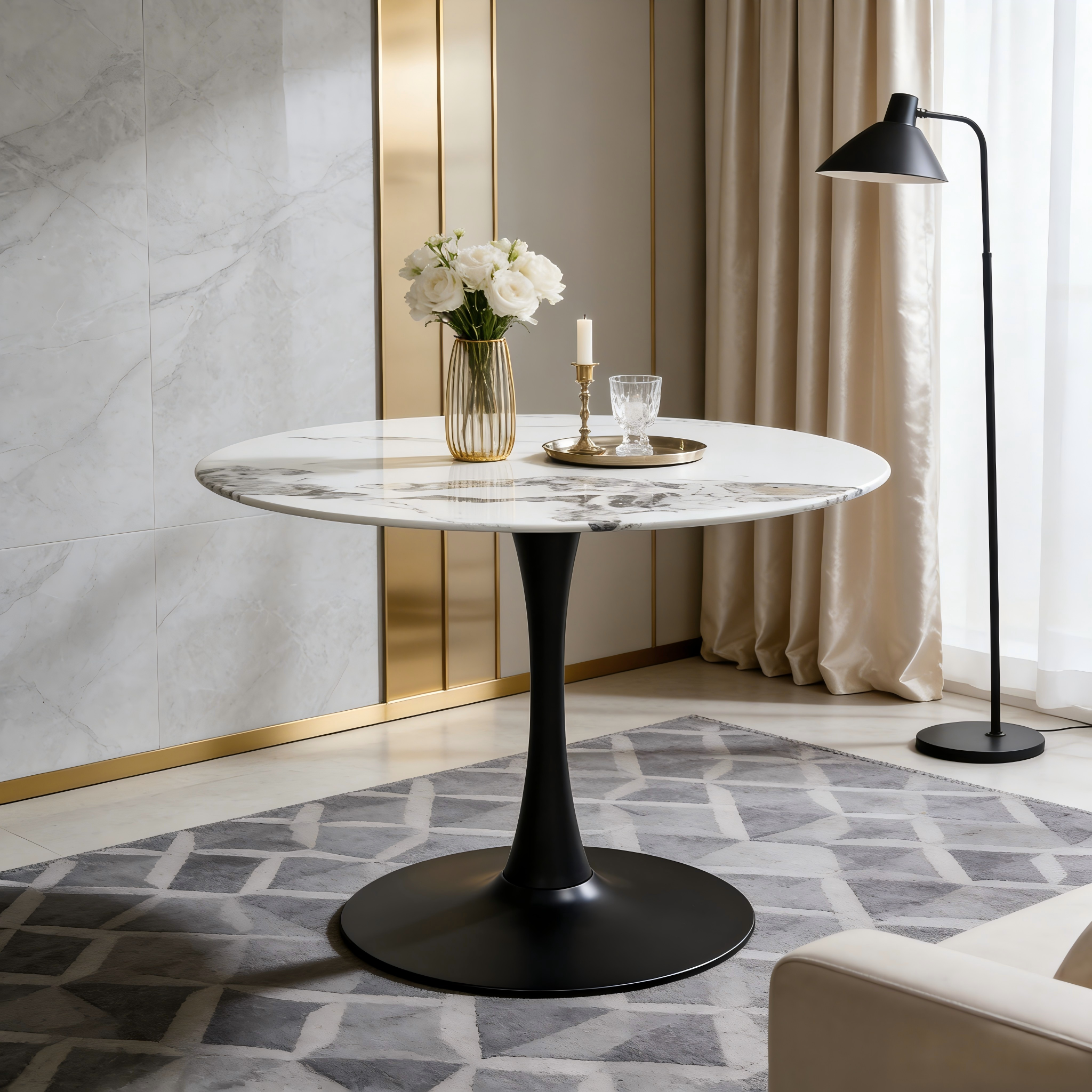 Three-quarter view of the faux marble tulip table with black base in a modern gold-accent room