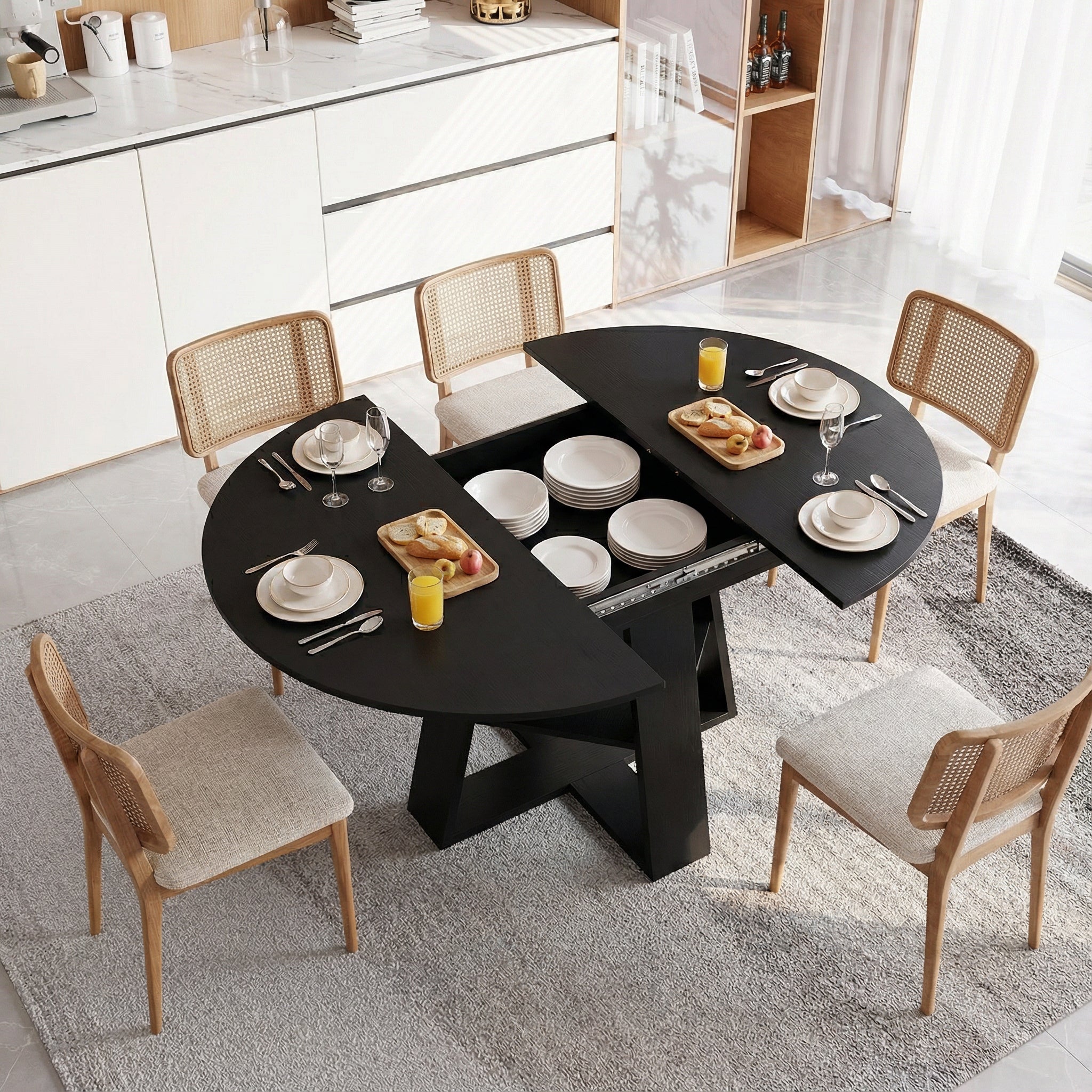 Overhead styled view of the black table opened with dishes stored inside