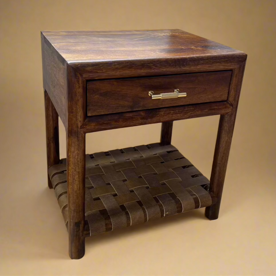 corner view of solid mango nightstand with single shelf gold handle and woven shelf below