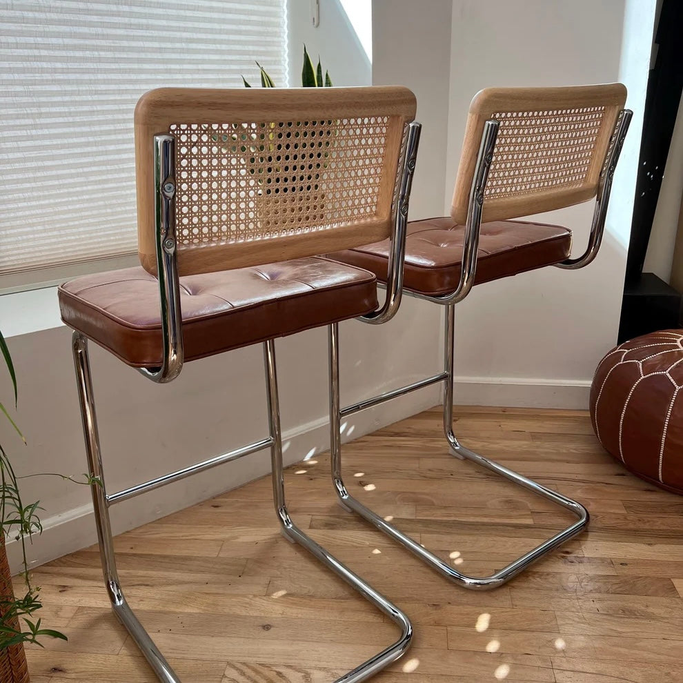 bar stools for a 36 inch counter height with 26 inch high seats of brown vegan leather with solid wood and rattan accent backrests