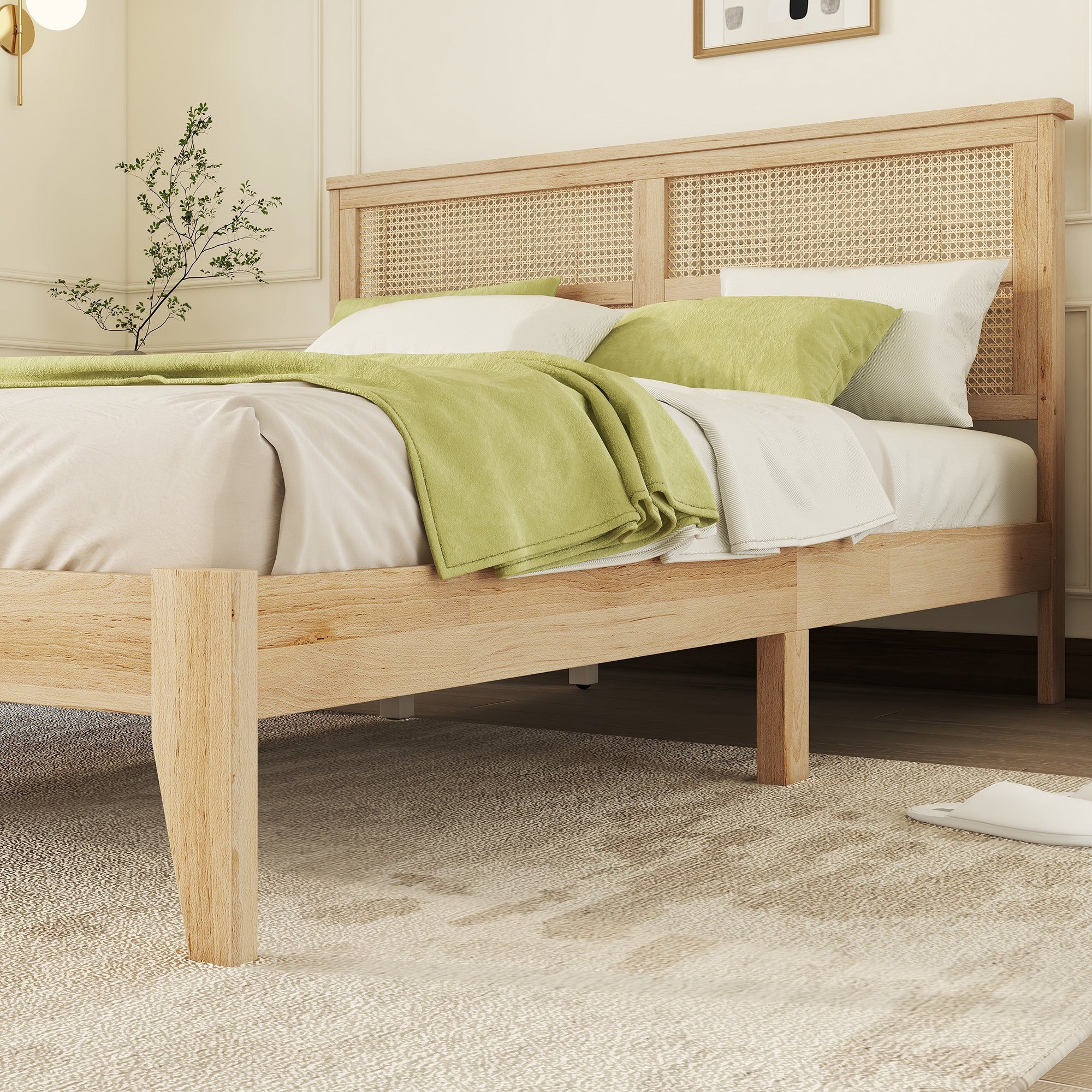Side view of the natural rubberwood queen bed with rattan headboard and slippers on the floor beside it