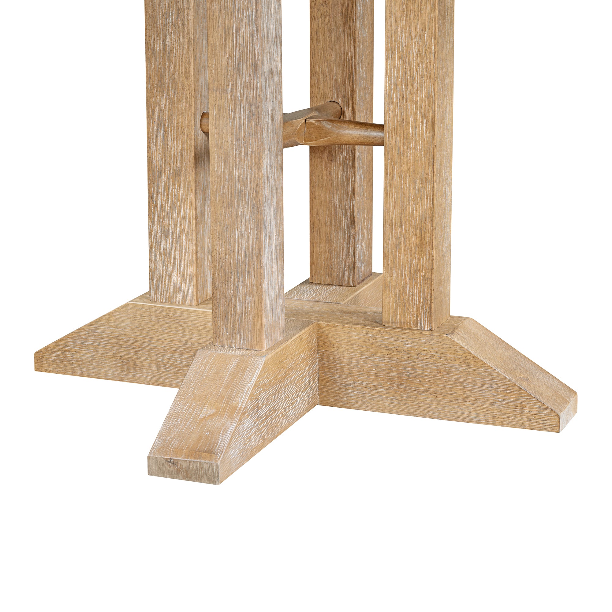 Close-up of the natural oak pedestal legs and cross-shaped feet