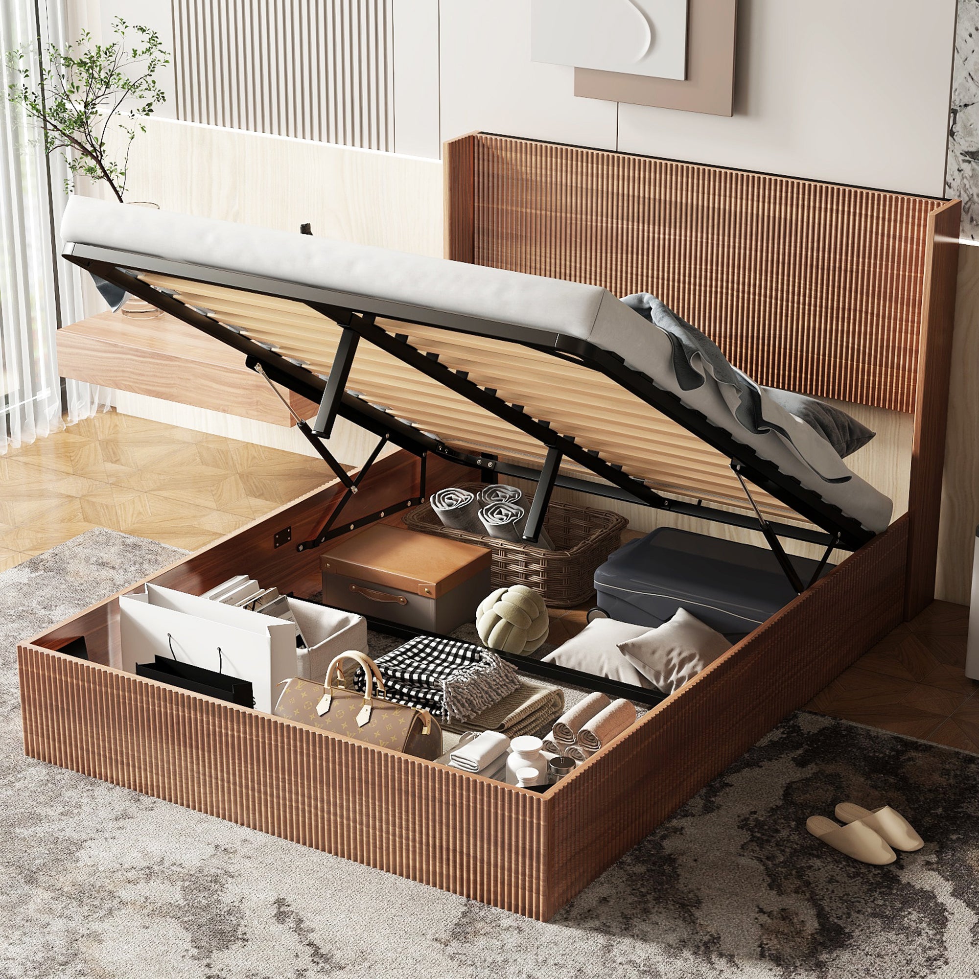 Natural wood storage bed lifted on struts, showing under-bed space filled with luggage, baskets and bedding