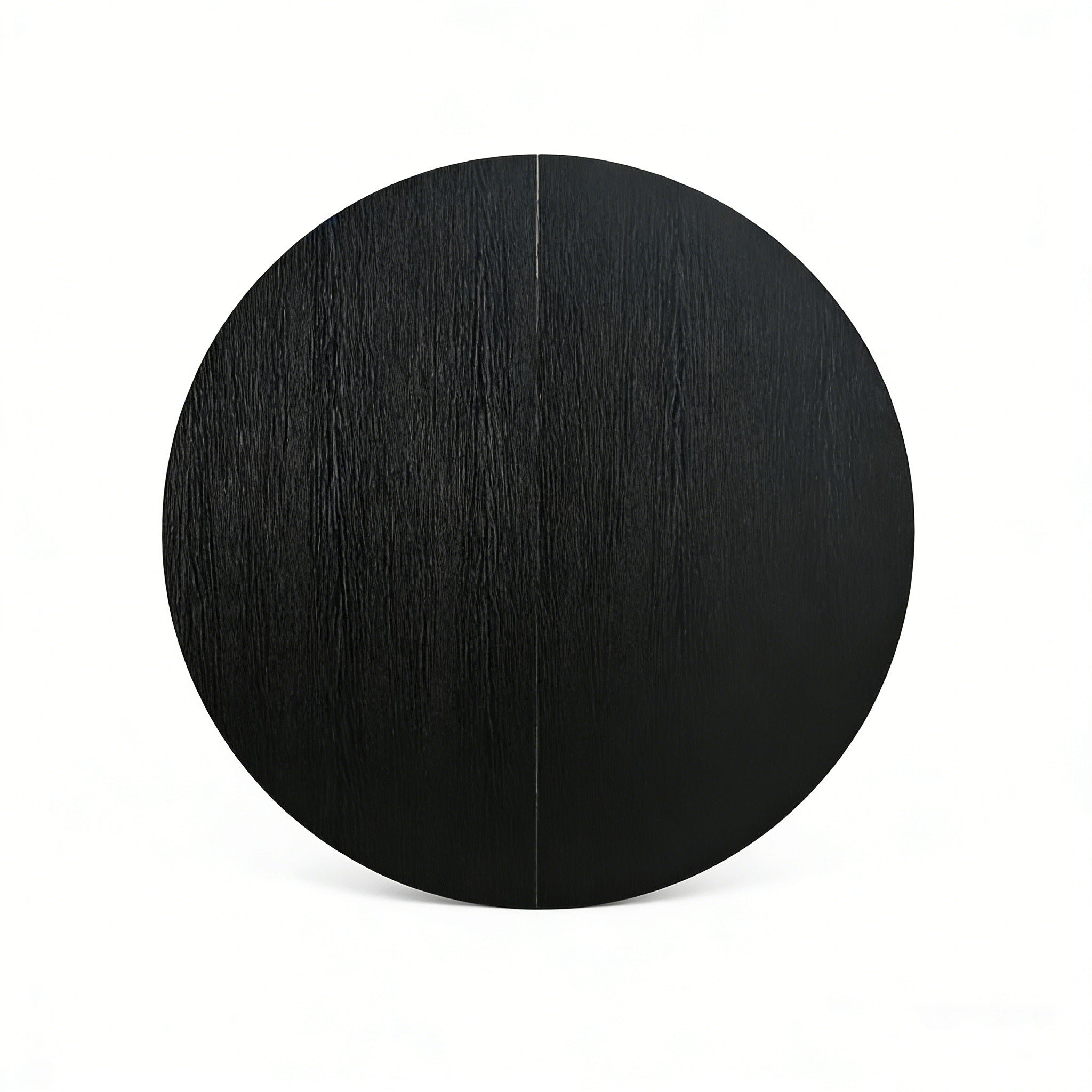 Overhead close-up of the black round tabletop with the center seam