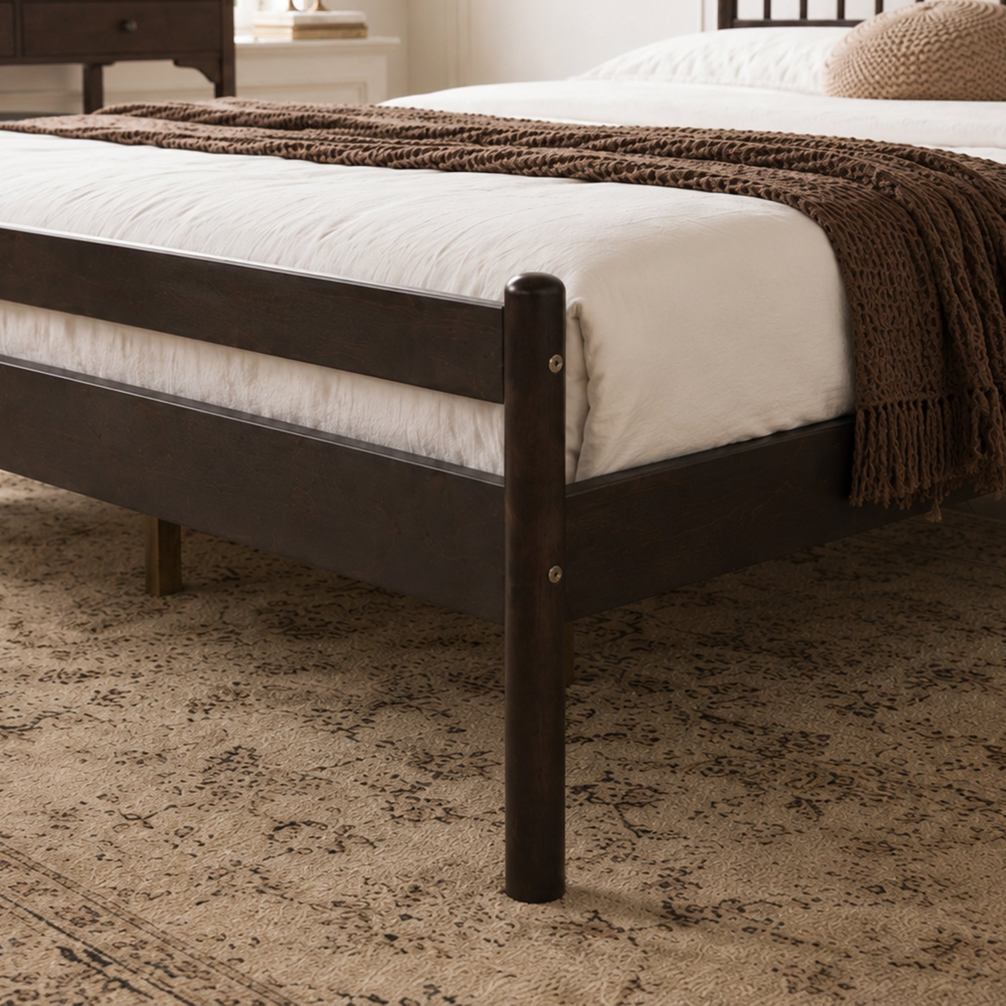 Close-up of footboard corner post and mattress edge