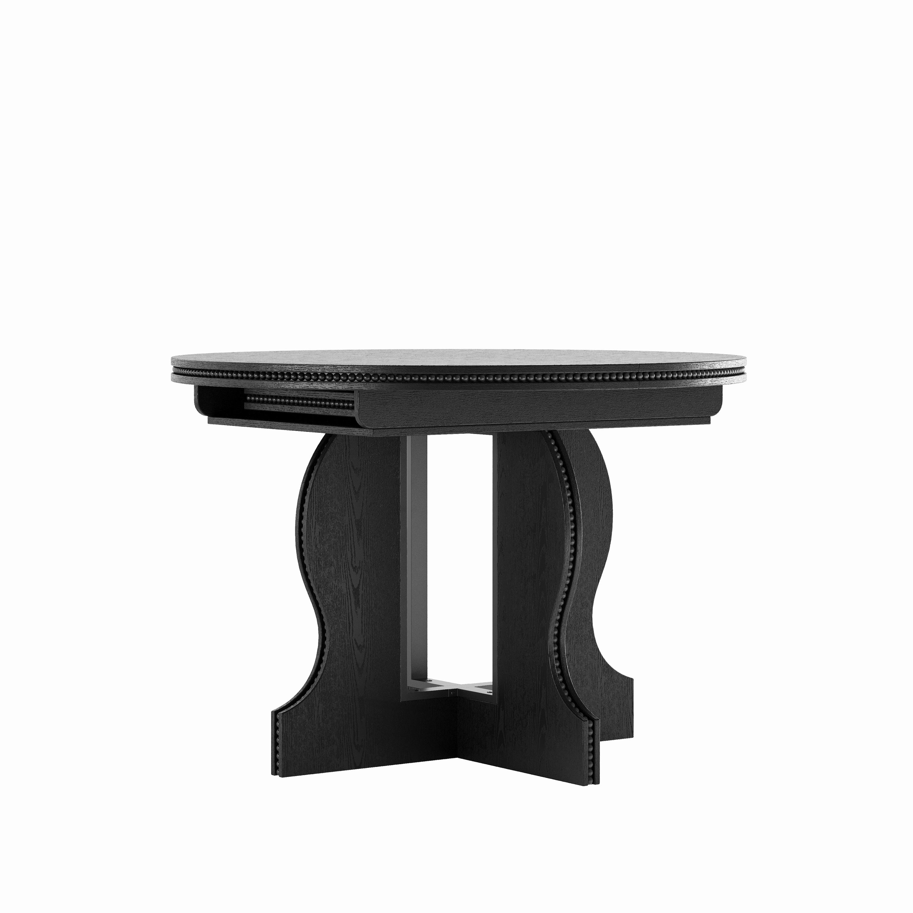 Black round pedestal dining table with beaded edge, front view on a plain white studio background
