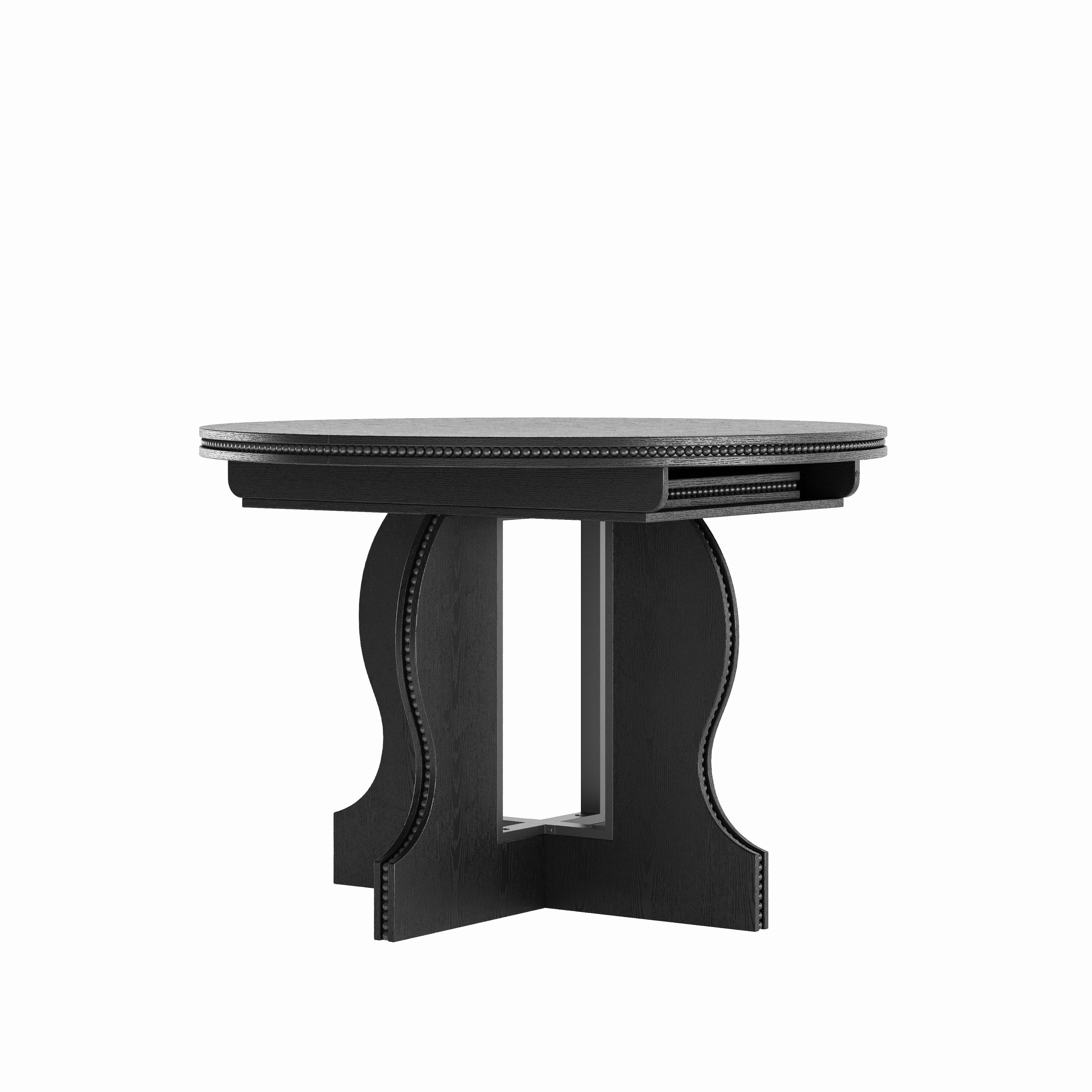 Black round pedestal dining table showing the extension slot beneath the top, front view on white