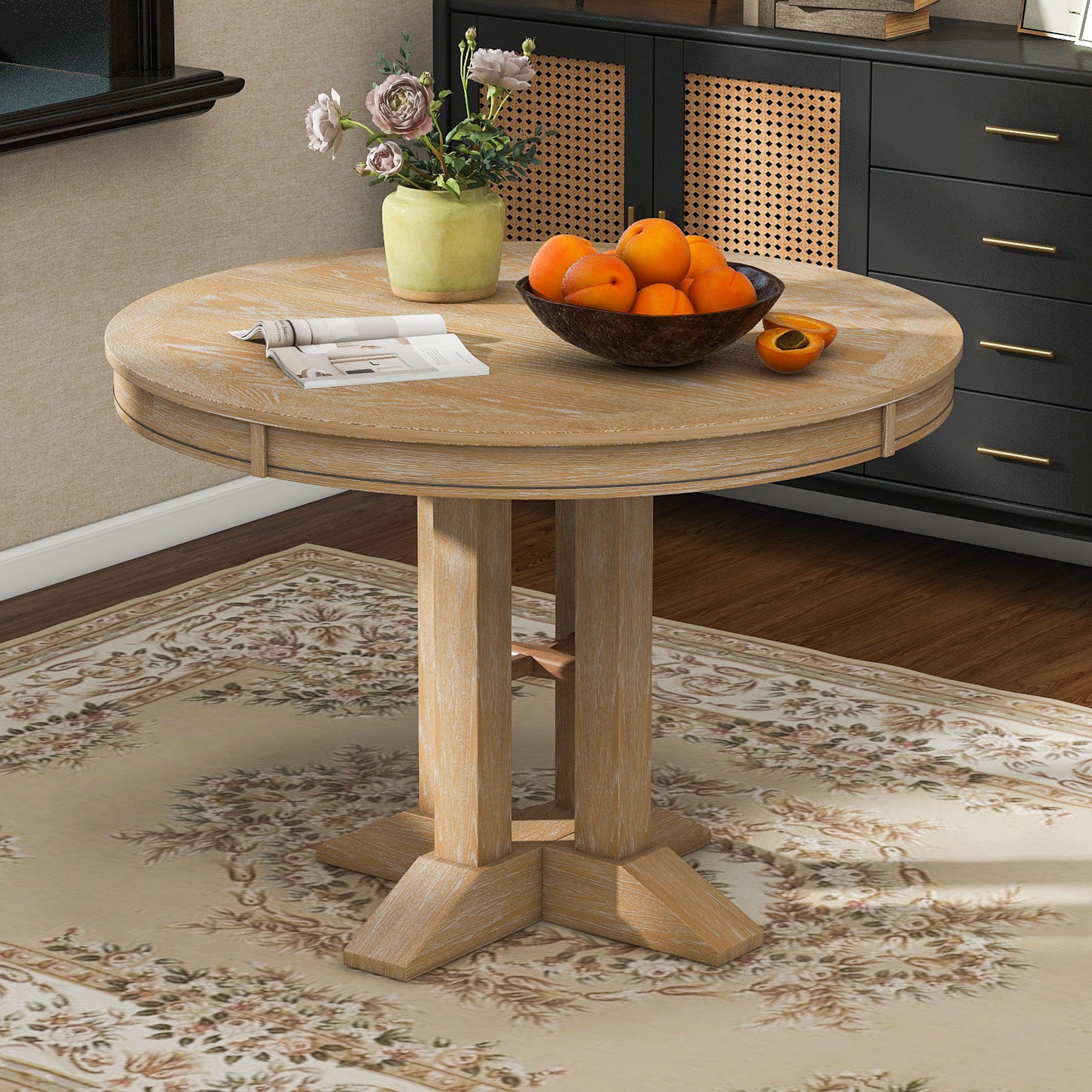 Overhead view of the round natural oak table in a styled room