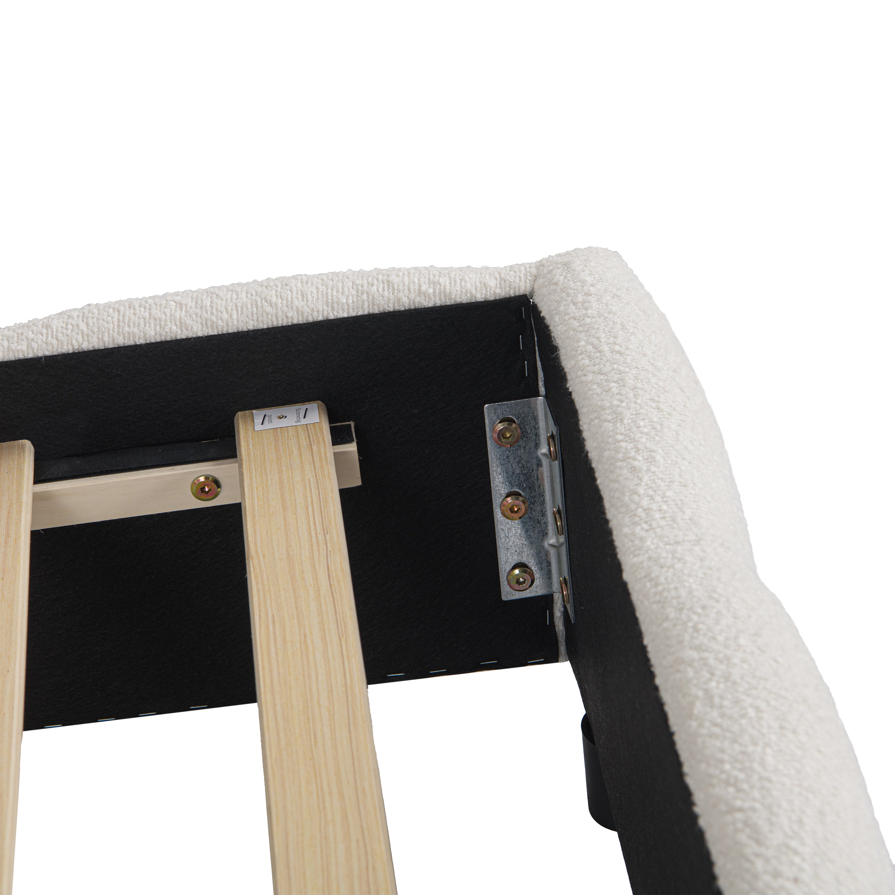 Close-up of channel-tufted beige bouclé fabric seams on headboard