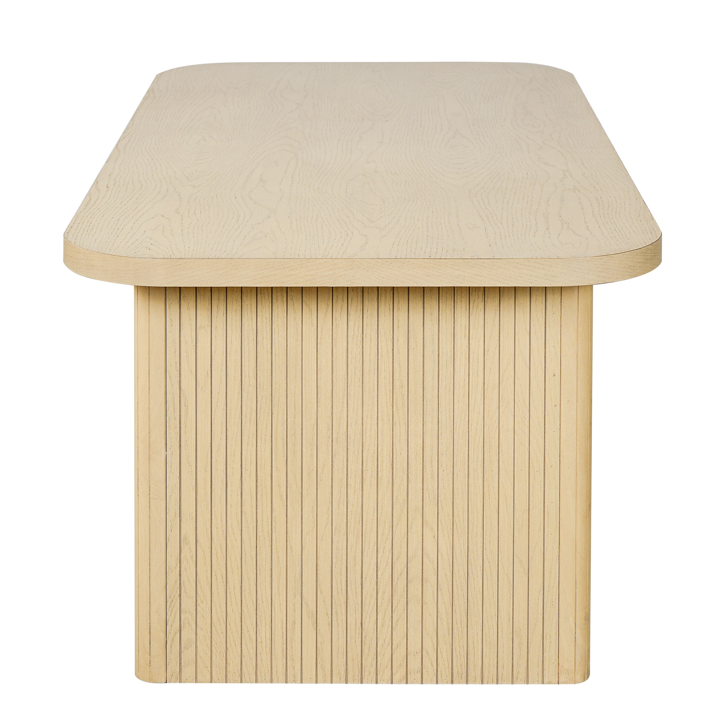 Side profile of the natural oak dining table showing the rounded top edge and fluted leg