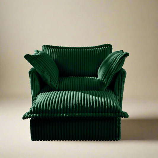 forward shot of the big fluffy chair sofa in emerald corduroy showing the rich texture and color as well as the wide and deep seat with plush cushions