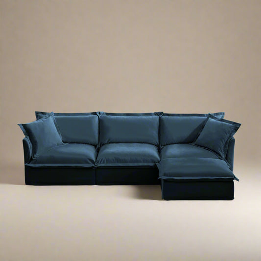 front shot of a machine washable chenille navy l shaped sectional showing the rich blue color and removable slipcovers, deep seats, and pet friendly nature