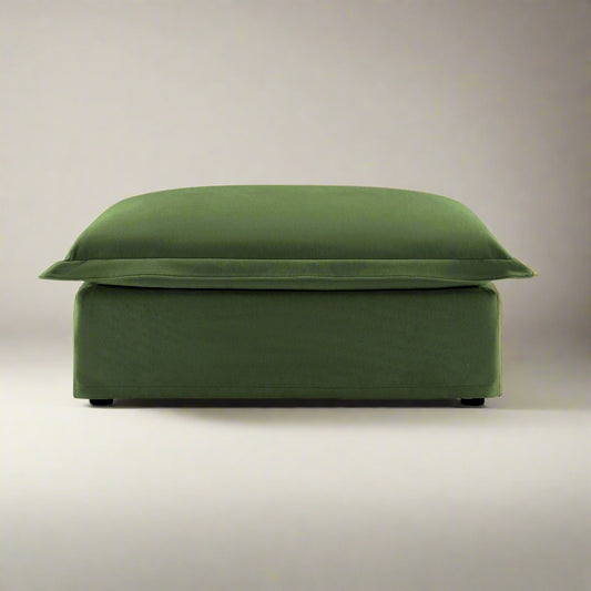 studio shot of the fluffy couch ottoman showing the rich olive chenille color and plush seat