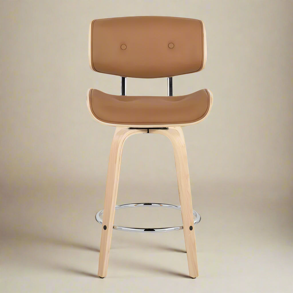 forward shot of one of the 2 swivel counter stools showing the high quality vegan leather and the stainless steel footrest