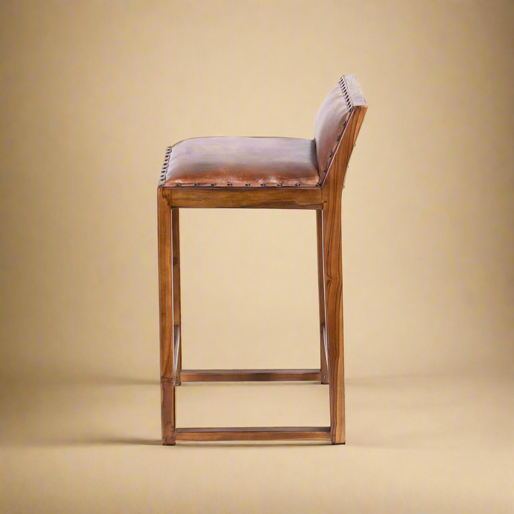side shot of genuine leather solid wood counter stool natural light showing wood pattern and studs