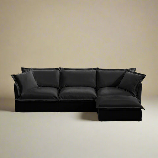front view of a fluffy black couch with modular sectional pieces showing chenille texture for comfort and the machine washable slipcovers