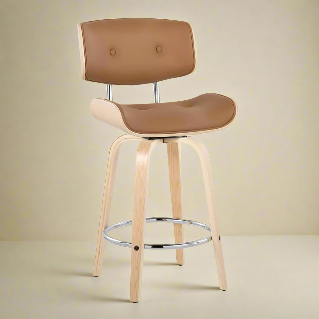 image of one of the set of two counter stools showing a quarter turn the natural wood seat and back as well as the vegan leather padding