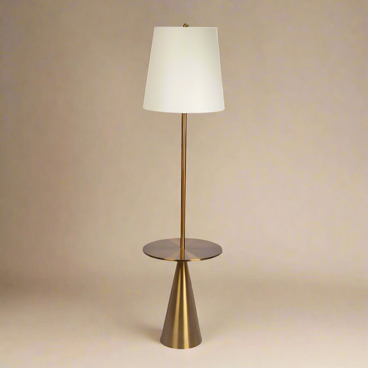 straight photo of a mid century brass floor lamp with an end table built in feature and a lamp shade
